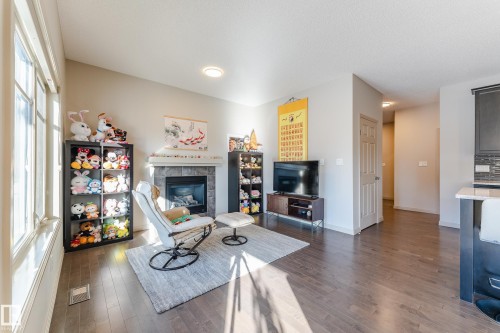 1945 Ainslie Link, Edmonton, AB - Indoor Photo Showing Living Room With Fireplace