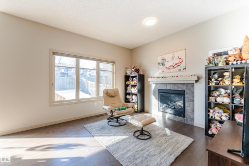 1945 Ainslie Link, Edmonton, AB - Indoor Photo Showing Living Room With Fireplace