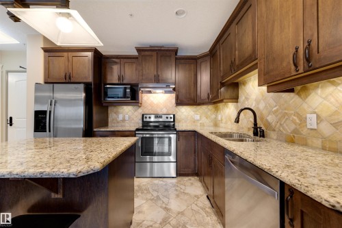 906 10142 111 Street, Edmonton, AB - Indoor Photo Showing Kitchen With Stainless Steel Kitchen With Double Sink With Upgraded Kitchen