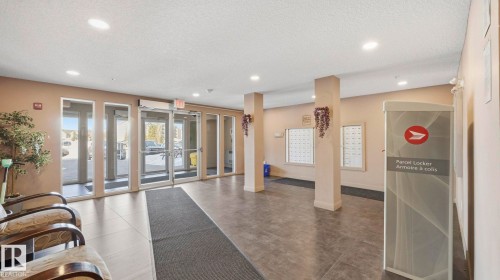 Community lobby with a textured ceiling and recessed lighting - 319 274 Mcconachie Drive, Edmonton, AB - Indoor Photo Showing Other Room