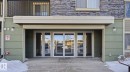 Snow covered property entrance with stone siding - 319 274 Mcconachie Drive, Edmonton, AB  - Outdoor 