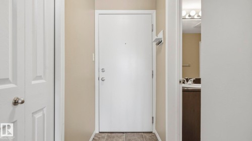 Doorway to outside featuring baseboards and a sink - 319 274 Mcconachie Drive, Edmonton, AB - Indoor Photo Showing Other Room