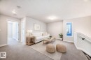 Carpeted living area with baseboards and recessed lighting - 2282 Chokecherry Close, Edmonton, AB  - Indoor 