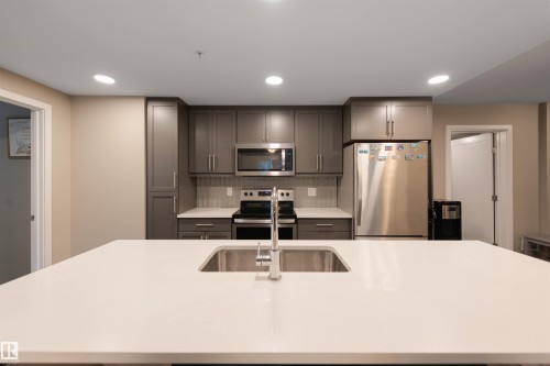 121 5504 Schonsee Drive, Edmonton, AB - Indoor Photo Showing Kitchen With Stainless Steel Kitchen With Double Sink With Upgraded Kitchen