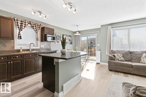 97 Keystone Crescent, Leduc, AB - Indoor Photo Showing Kitchen With Double Sink