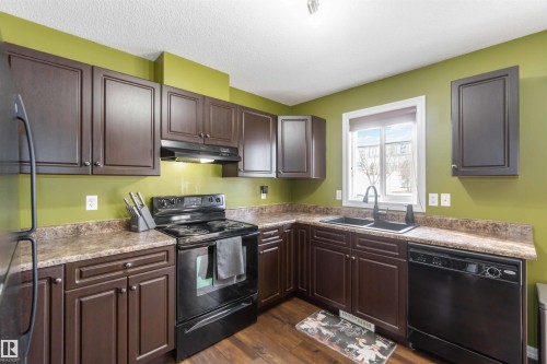 20 1404 Hermitage Road, Edmonton, AB - Indoor Photo Showing Kitchen With Double Sink