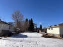 View of yard layered in snow - 10430 79St Nw, Edmonton, AB 