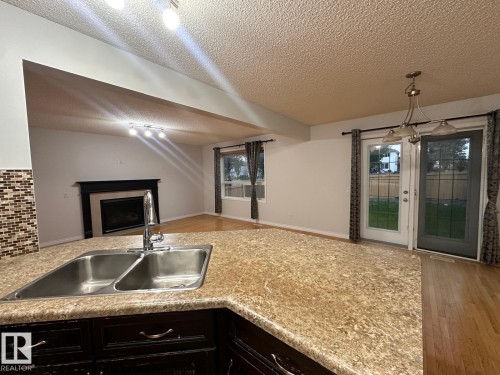 1569 37A Avenue, Edmonton, AB - Indoor Photo Showing Kitchen With Double Sink