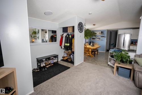 The interior features light-colored walls and a mix of new carpet and linoleum flooring - 41 Graywood Cove, Stony Plain, AB - Indoor Photo Showing Other Room