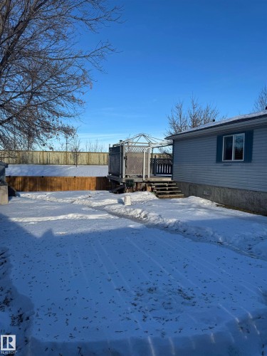 Yard layered in snow featuring a deck - 41 Graywood Cove, Stony Plain, AB - Outdoor