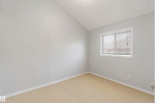 Unfurnished room with vaulted ceiling and light carpet - 20604 48 Avenue, Edmonton, AB - Indoor Photo Showing Other Room