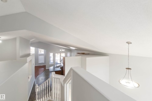 Hall with vaulted ceiling, a chandelier, and an upstairs landing - 20604 48 Avenue, Edmonton, AB - Indoor Photo Showing Other Room
