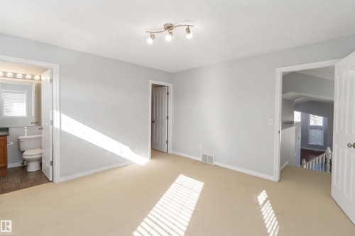 Unfurnished room featuring light carpet and baseboards - 20604 48 Avenue, Edmonton, AB - Indoor Photo Showing Other Room