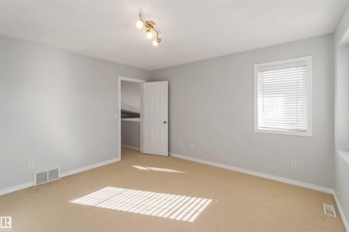 Unfurnished bedroom with light carpet and a closet - 20604 48 Avenue, Edmonton, AB - Indoor Photo Showing Other Room