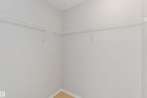 Walk in closet featuring light colored carpet - 20604 48 Avenue, Edmonton, AB - Indoor With Storage