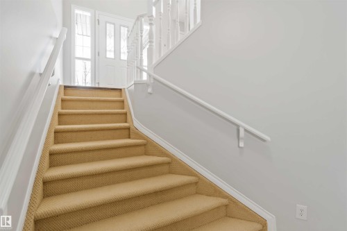 Stairway featuring baseboards - 20604 48 Avenue, Edmonton, AB - Indoor Photo Showing Other Room