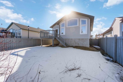 Snow covered property featuring a fenced backyard and a deck - 20604 48 Avenue, Edmonton, AB - Outdoor
