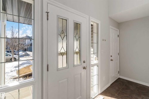 Doorway featuring tile patterned floors and baseboards - 20604 48 Avenue, Edmonton, AB - Indoor Photo Showing Other Room