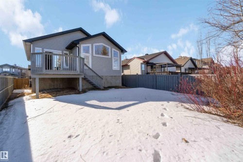 Back of house featuring a fenced backyard and a wooden deck - 20604 48 Avenue, Edmonton, AB - Outdoor With Deck Patio Veranda