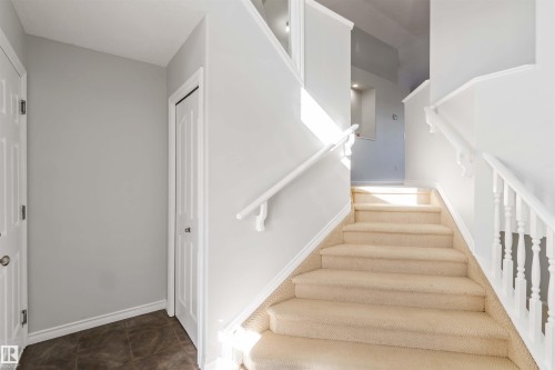 Stairs with baseboards - 20604 48 Avenue, Edmonton, AB - Indoor Photo Showing Other Room