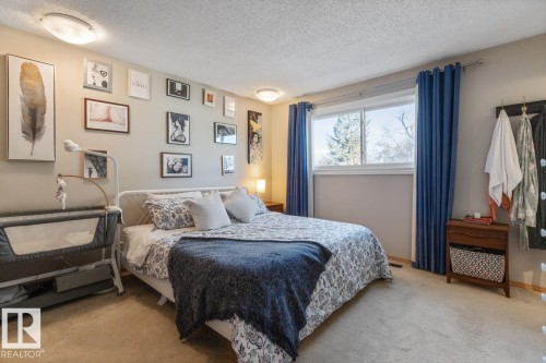 Bedroom featuring light colored carpet and a textured ceiling - 14 Lester Crescent, St. Albert, AB - Indoor Photo Showing Bedroom