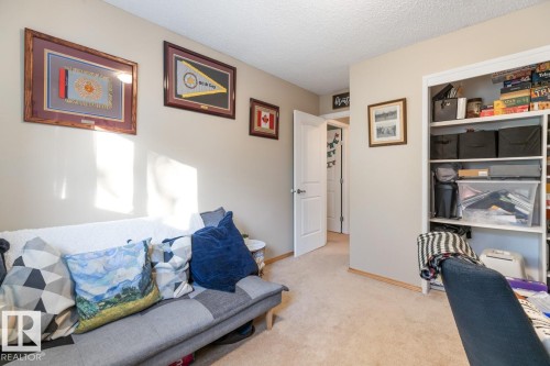 Sitting room with light carpet and a textured ceiling - 14 Lester Crescent, St. Albert, AB - Indoor
