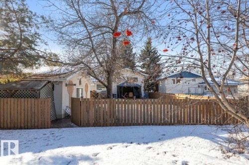 Snow covered rear of property featuring a residential view - 14 Lester Crescent, St. Albert, AB - Outdoor