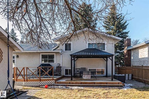 Rear view of property featuring a gazebo, stucco siding, a deck, and a metal roof - 14 Lester Crescent, St. Albert, AB - Outdoor With Deck Patio Veranda