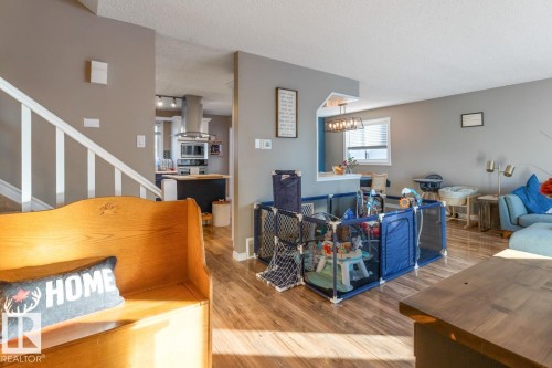 Living area with wood finished floors and a textured ceiling - 14 Lester Crescent, St. Albert, AB - Indoor