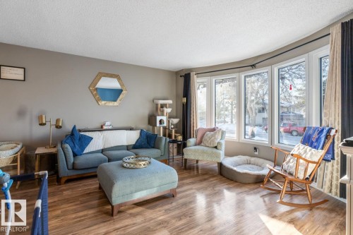 Living room featuring wood finished floors and a textured ceiling - 14 Lester Crescent, St. Albert, AB - Indoor Photo Showing Living Room