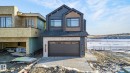 View of front of property with a shingled roof and a garage - 8765 Mayday Lane, Edmonton, AB  - Outdoor 