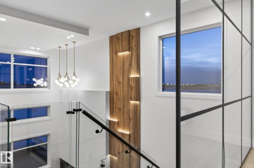 Stairway with recessed lighting - 8765 Mayday Lane, Edmonton, AB - Indoor Photo Showing Other Room