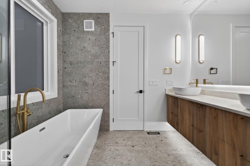 Full bath with a freestanding bath and double vanity - 8765 Mayday Lane, Edmonton, AB - Indoor Photo Showing Bathroom