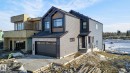 View of front of property featuring a garage and a shingled roof - 8765 Mayday Lane, Edmonton, AB  - Outdoor 