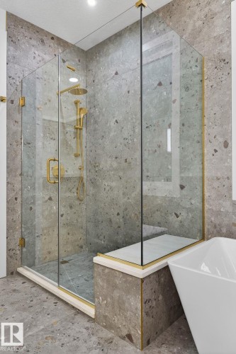 Bathroom featuring a shower stall, a soaking tub, and unfinished concrete floors - 8765 Mayday Lane, Edmonton, AB - Indoor Photo Showing Other Room