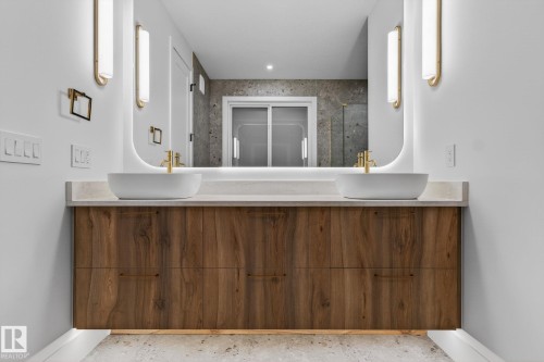 Bathroom with double vanity, a shower, and wallpapered walls - 8765 Mayday Lane, Edmonton, AB - Indoor Photo Showing Other Room