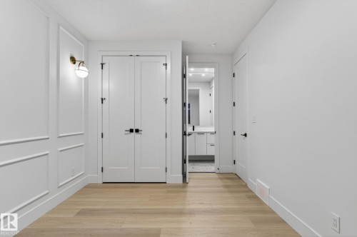 Hall with light wood finished floors - 8765 Mayday Lane, Edmonton, AB - Indoor Photo Showing Other Room