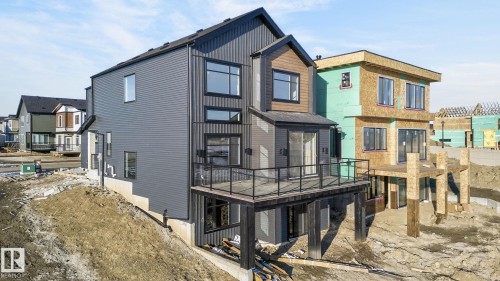 Rear view of property with a patio, a balcony, and a residential view - 8765 Mayday Lane, Edmonton, AB - Outdoor