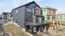 Rear view of property with a patio, a balcony, and a residential view - 8765 Mayday Lane, Edmonton, AB  - Outdoor 