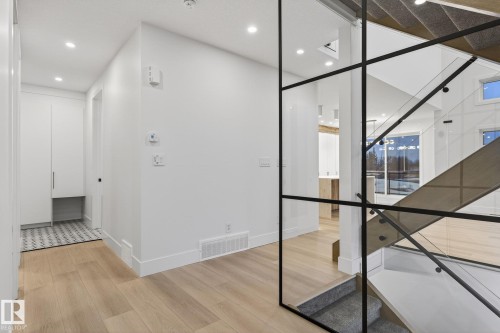 Hallway featuring light wood-style floors and recessed lighting - 8765 Mayday Lane, Edmonton, AB - Indoor Photo Showing Other Room