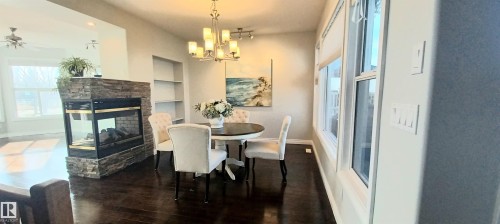 2036 Towne Centre Boulevard Nw, Edmonton, AB - Indoor Photo Showing Dining Room With Fireplace