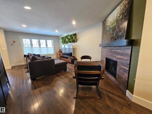 10433 70 Avenue, Edmonton, AB - Indoor Photo Showing Living Room With Fireplace