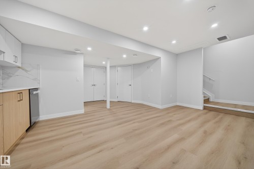 Finished below grade area with light wood-type flooring and recessed lighting - 20723 24 Avenue, Edmonton, AB - Indoor