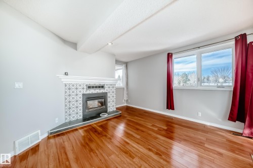 14934 43 Avenue, Edmonton, AB - Indoor Photo Showing Living Room With Fireplace