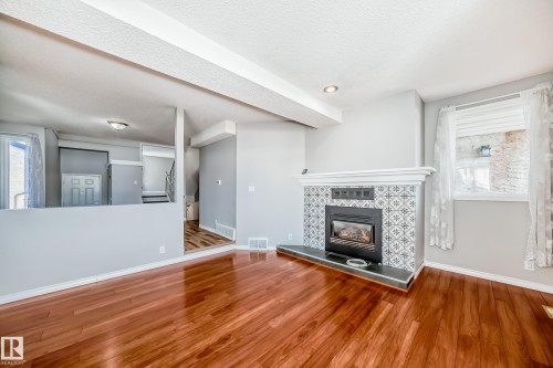 14934 43 Avenue, Edmonton, AB - Indoor Photo Showing Living Room With Fireplace