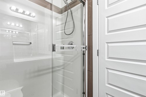 Bathroom featuring a stall shower - 106 1238 Windermere Way, Edmonton, AB - Indoor Photo Showing Bathroom