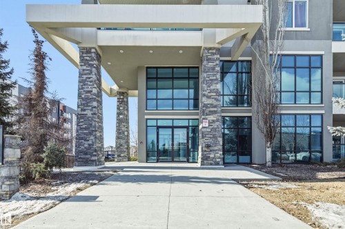 View of exterior entry with stone siding and stucco siding - 106 1238 Windermere Way, Edmonton, AB - Outdoor