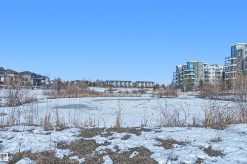 View of snowy yard - 106 1238 Windermere Way, Edmonton, AB - Outdoor