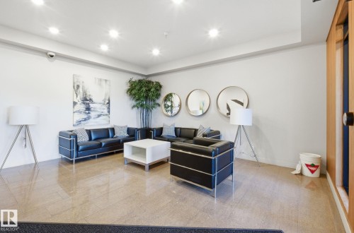 Living room featuring recessed lighting and baseboards - 309 625 Leger Way, Edmonton, AB - Indoor