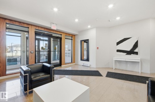 Common area with recessed lighting - 309 625 Leger Way, Edmonton, AB - Indoor Photo Showing Other Room
